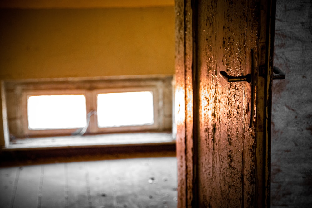 brown wooden door with glass panel