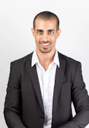 A smiling professional presenting a service to clients.