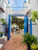 A charming courtyard with local plants, colorful tiles, and handcrafted decor in the heart of the hotel.