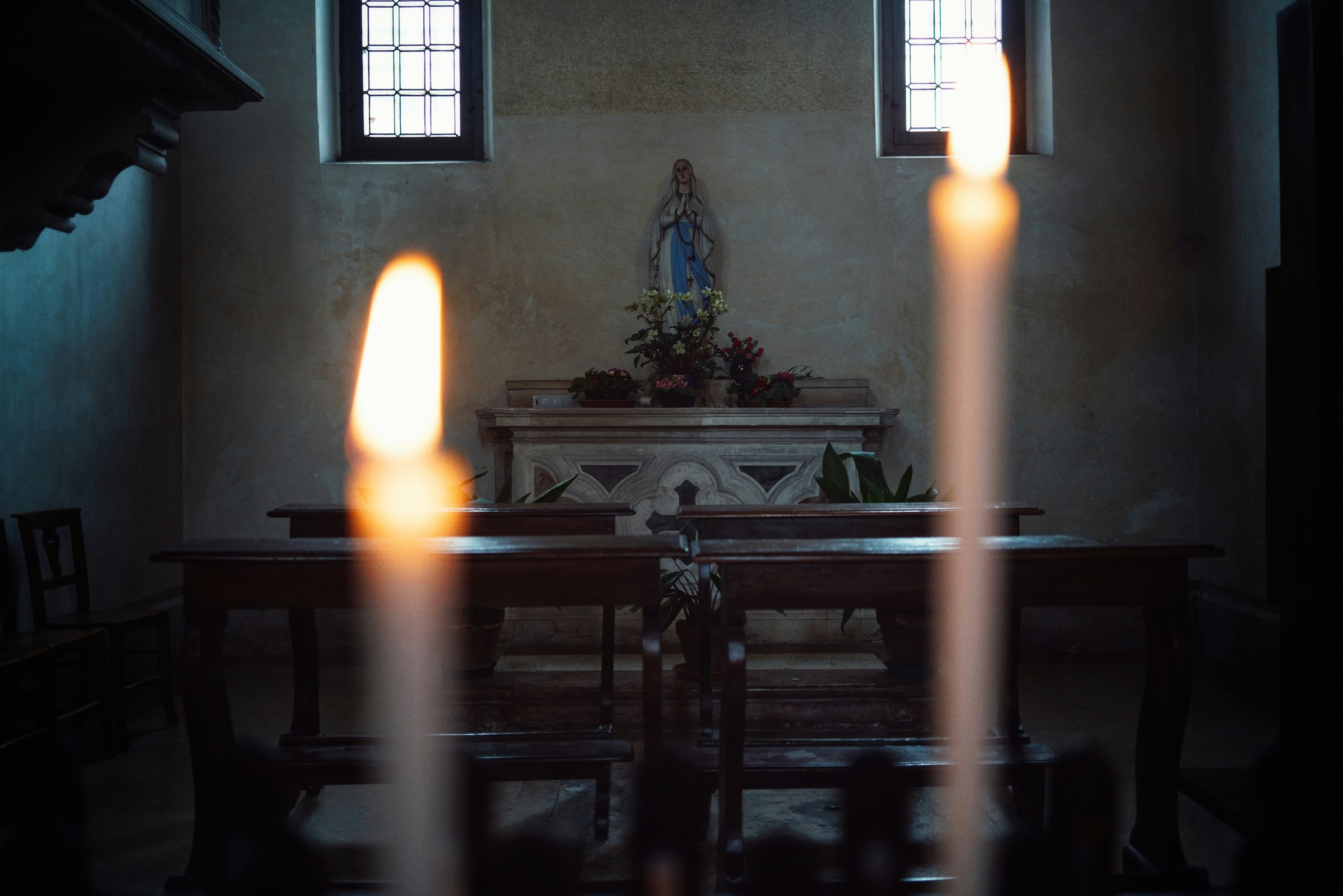 white candles on black glass table