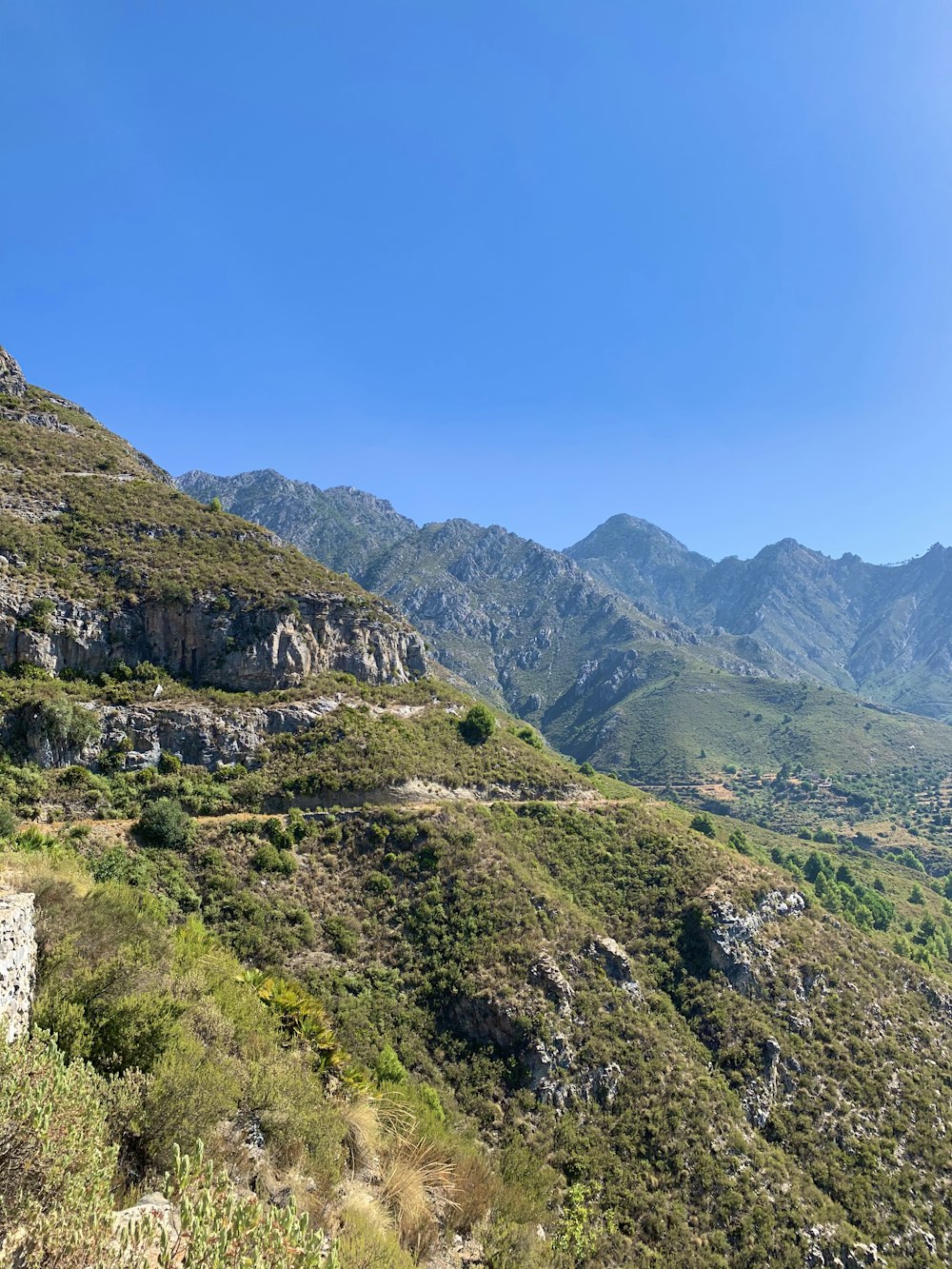 green and brown mountain under blue sky during daytime