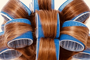 A close-up of the reusable hair roller removing pet hair from a wool coat