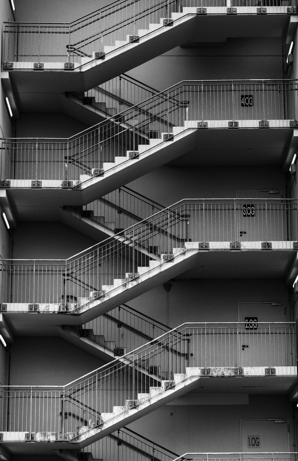 grayscale photo of spiral staircase