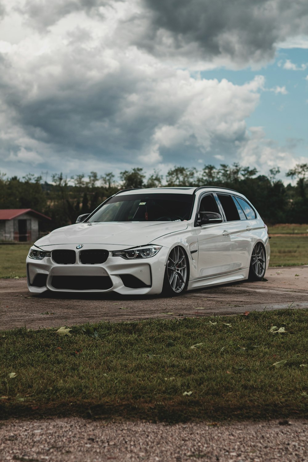 white bmw m 3 coupe on green grass field