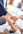 person in black long sleeve shirt holding persons hand