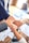 person in black long sleeve shirt holding persons hand