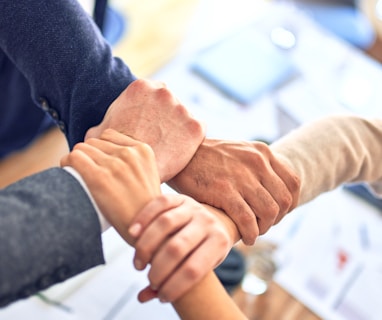 person in black long sleeve shirt holding persons hand