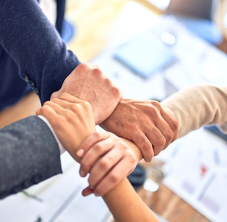 person in black long sleeve shirt holding persons hand