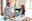 man in white dress shirt sitting beside woman in black long sleeve shirt