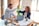 man in white dress shirt sitting beside woman in black long sleeve shirt