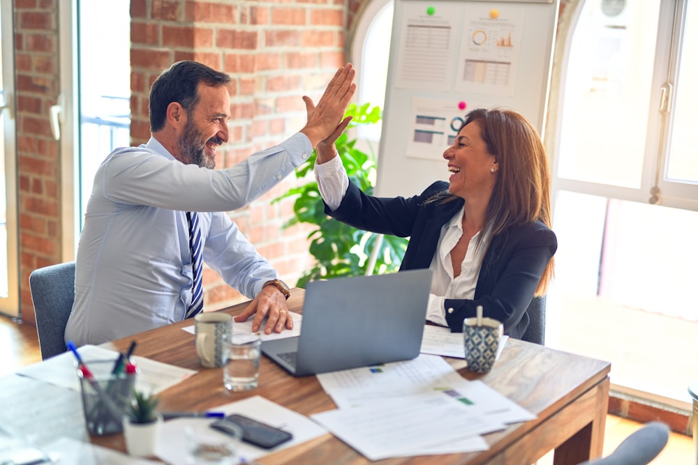 Smiling Businesswoman Greeting A Colleague On A Meeting Stock Photo -  Download Image Now - iStock