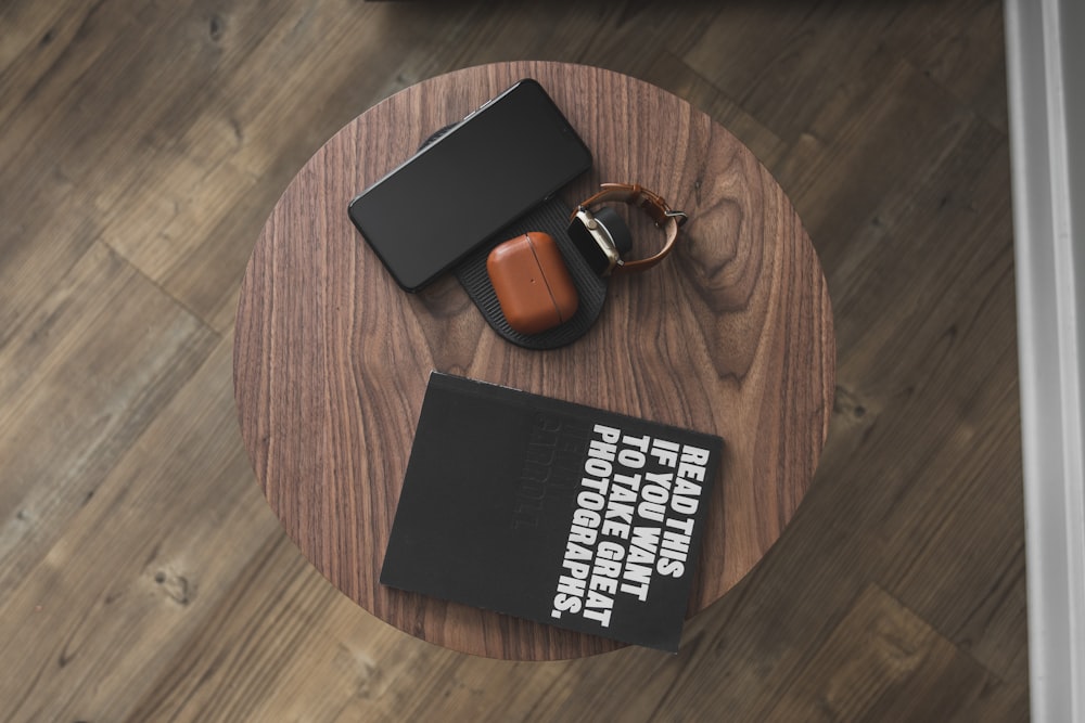 black and white book on brown wooden round table