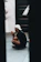Athlete sitting quietly on a bench, eyes closed, practicing breath control before a game.