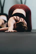 woman in red tank top lying on floor