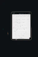 Open digital tablet displaying a beautifully designed self-care checklist with gold and cream accents
