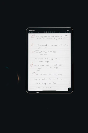 A person holding a tablet showing a protocol page with step-by-step health routines.