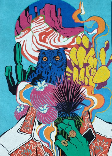 An intricate and vibrant illustration featuring a blue owl surrounded by surreal desert elements including cacti, flowers, and a hand with rings. The background showcases abstract red rock formations and swirling patterns, contributing to a psychedelic aesthetic.