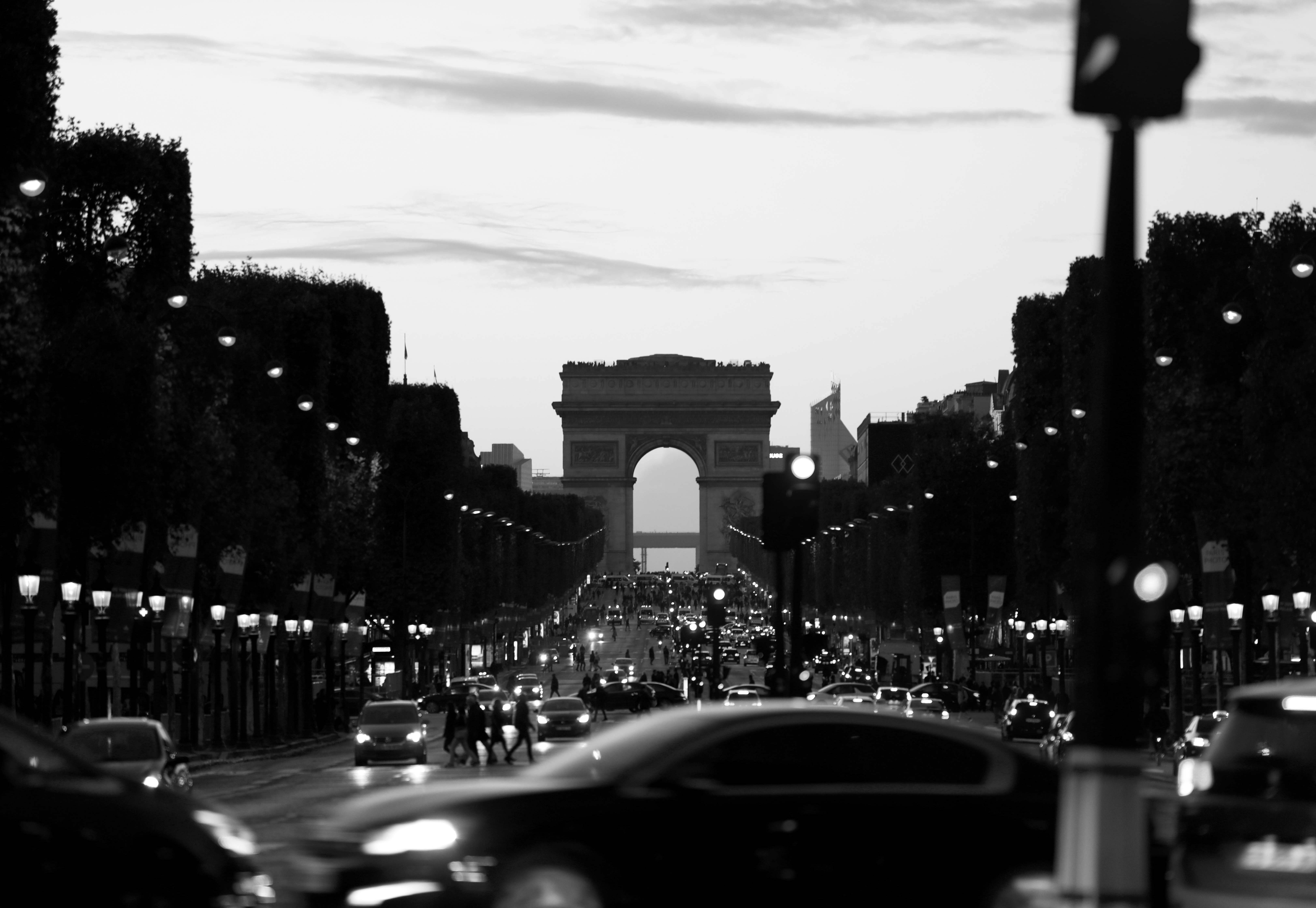 grayscale photo of cars on road