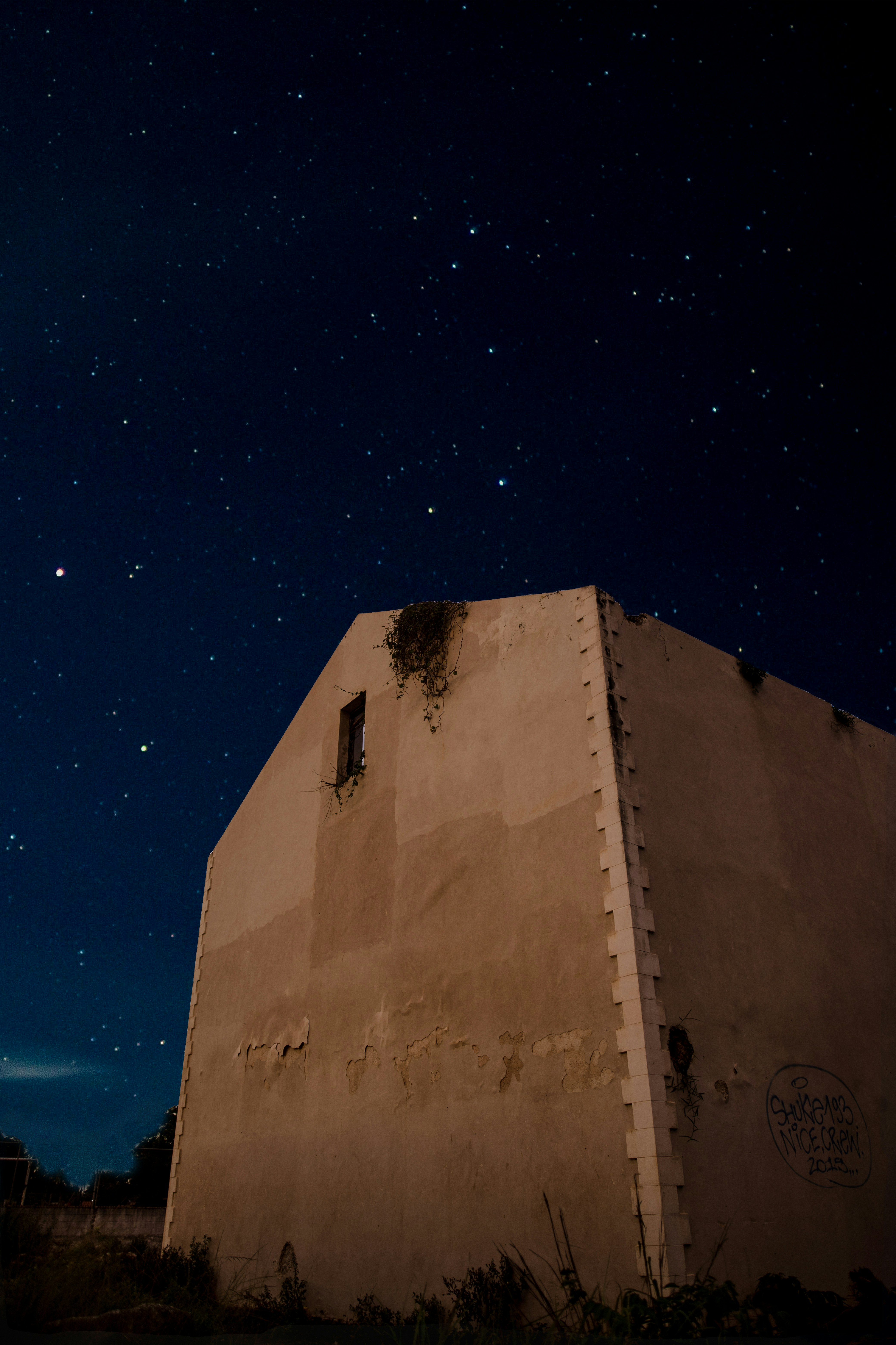 brown concrete building under blue sky during night time