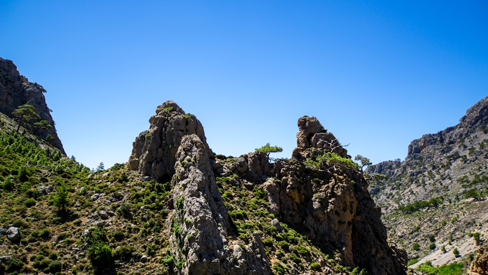 rocky mountain under blue sky during daytime