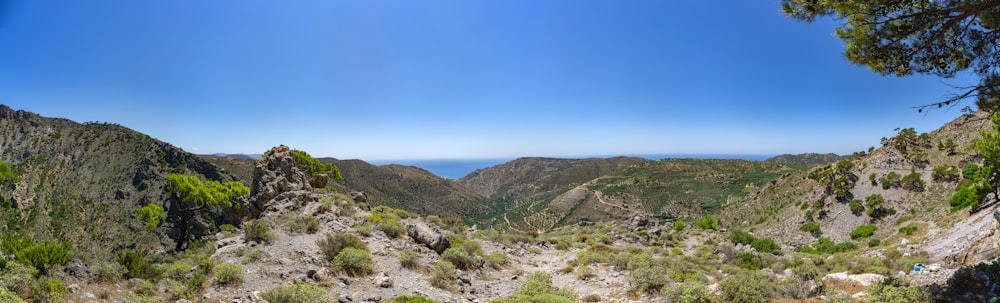 brown and green mountains under blue sky during daytime