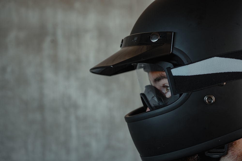man in black helmet and helmet