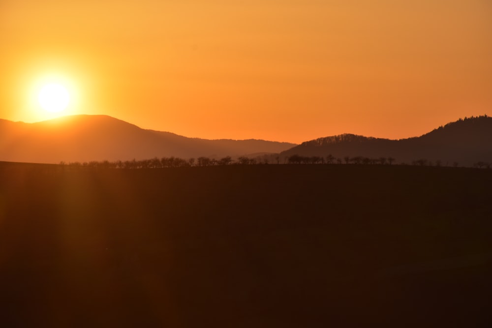 silhouette of mountain during sunset