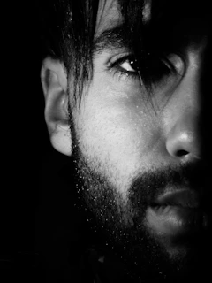 grayscale photo of mans face