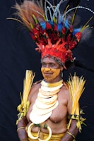 man in red and yellow floral headdress
