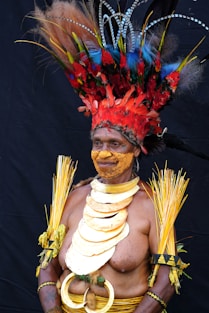 man in red and yellow floral headdress