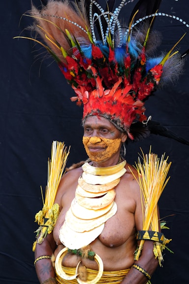 man in red and yellow floral headdress