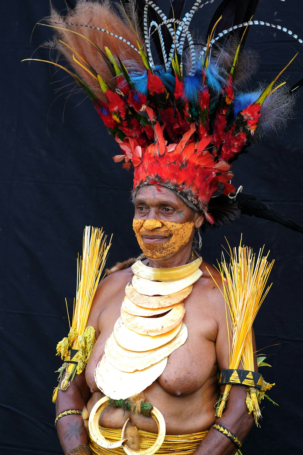 man in red and yellow floral headdress