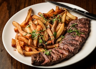 Some beautiful bastard cut up this delightful steak for me to photograph with truffle oil fries on the side. Part of the C9 Work WordPress Theme sample content imagery.