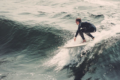 Aerial view of a surfer riding a clean peeling wave