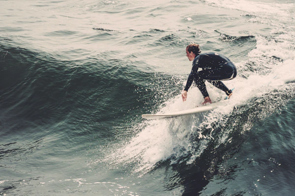 Aerial view of a surfer riding a clean NSW South Coast wave