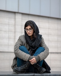 woman in blue denim jacket and black hijab