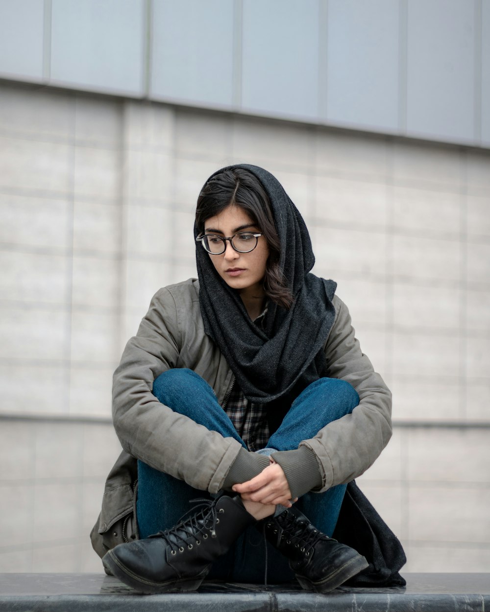 woman in blue denim jacket and black hijab