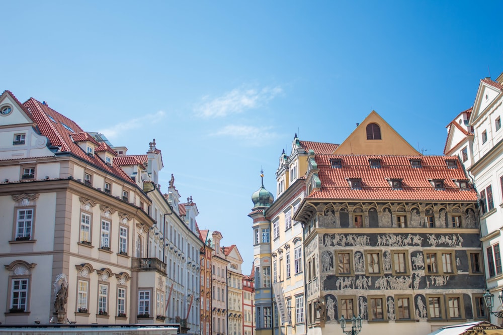 white and brown concrete buildings under blue sky during daytime