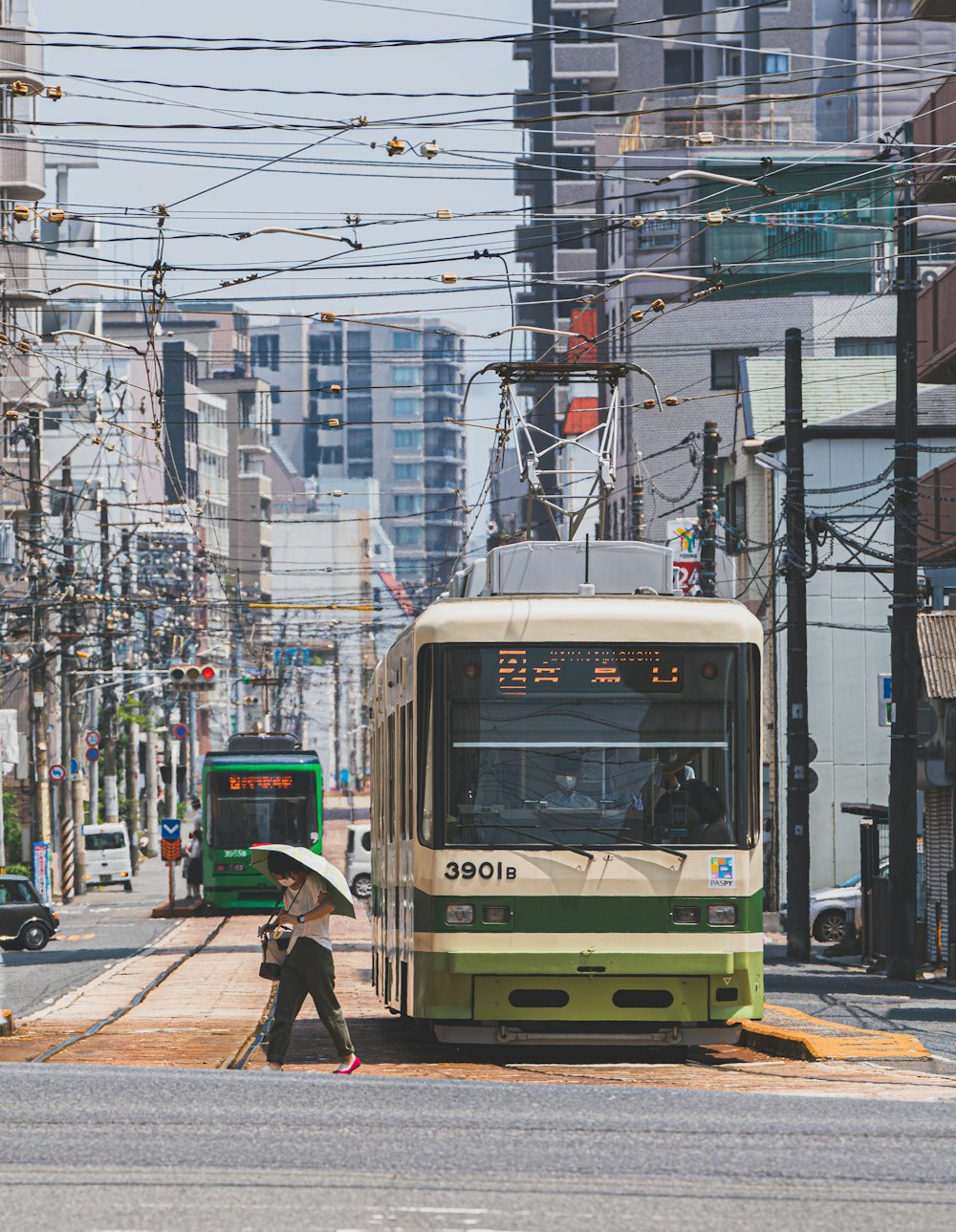 white and green train on the street