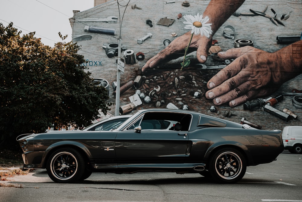 black coupe parked on street during daytime