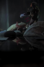 A glowing blue axolotl frog floating inside a swirling cosmic vortex with stars and nebulae.