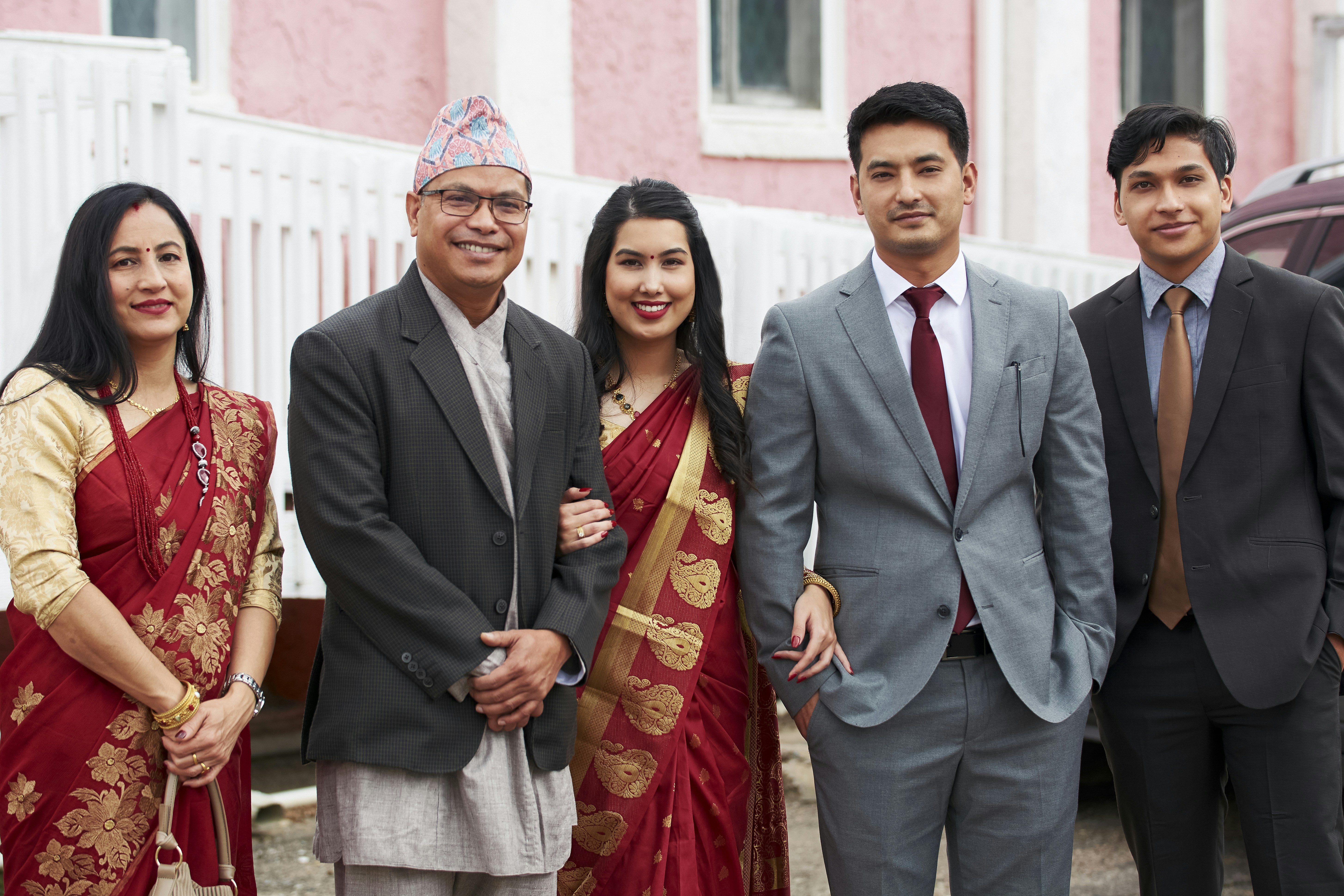 Guest photo showing traditional cooking lesson with host family in authentic Uttarakhand kitchen setting