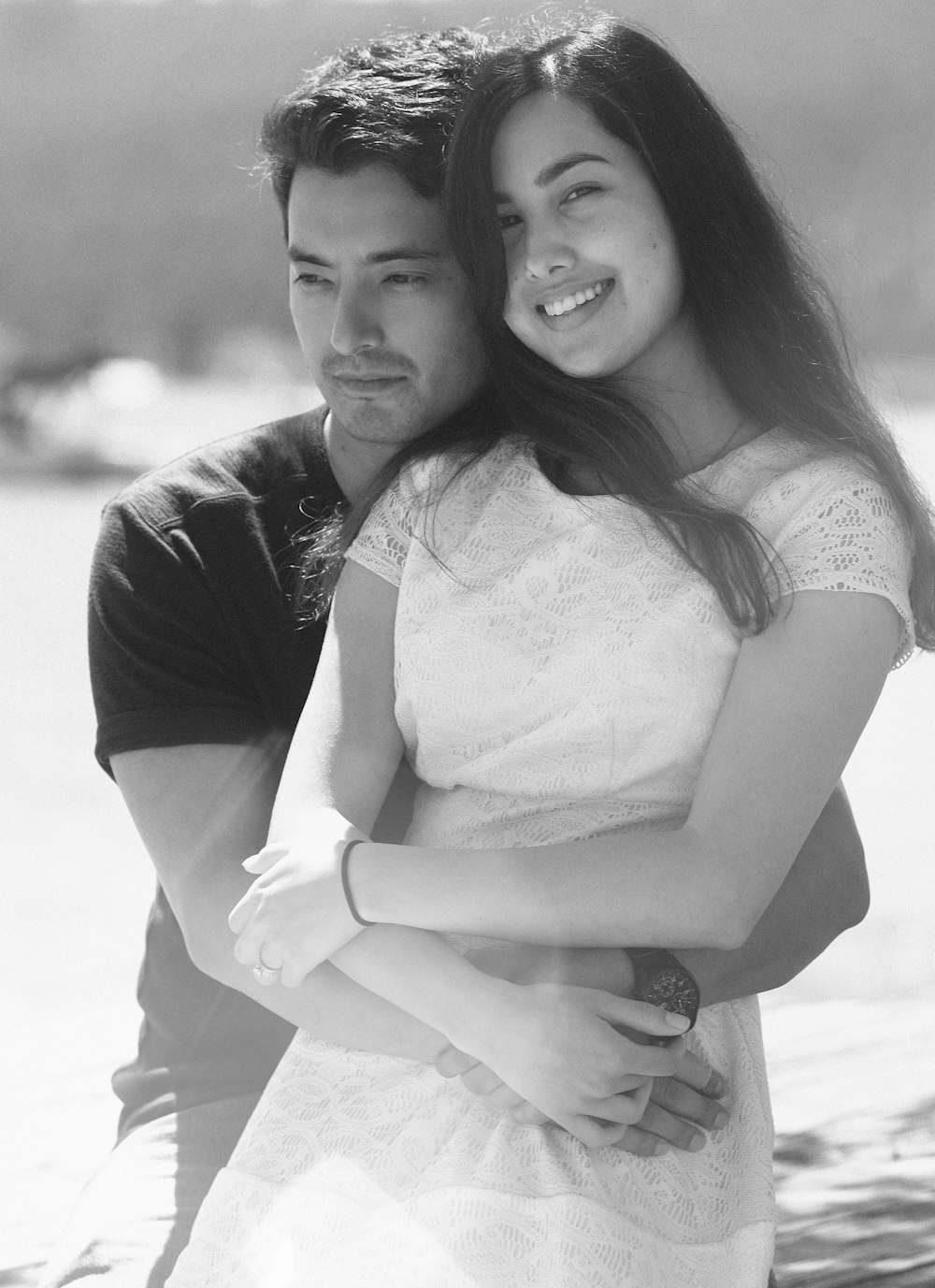 grayscale photo of man and woman smiling