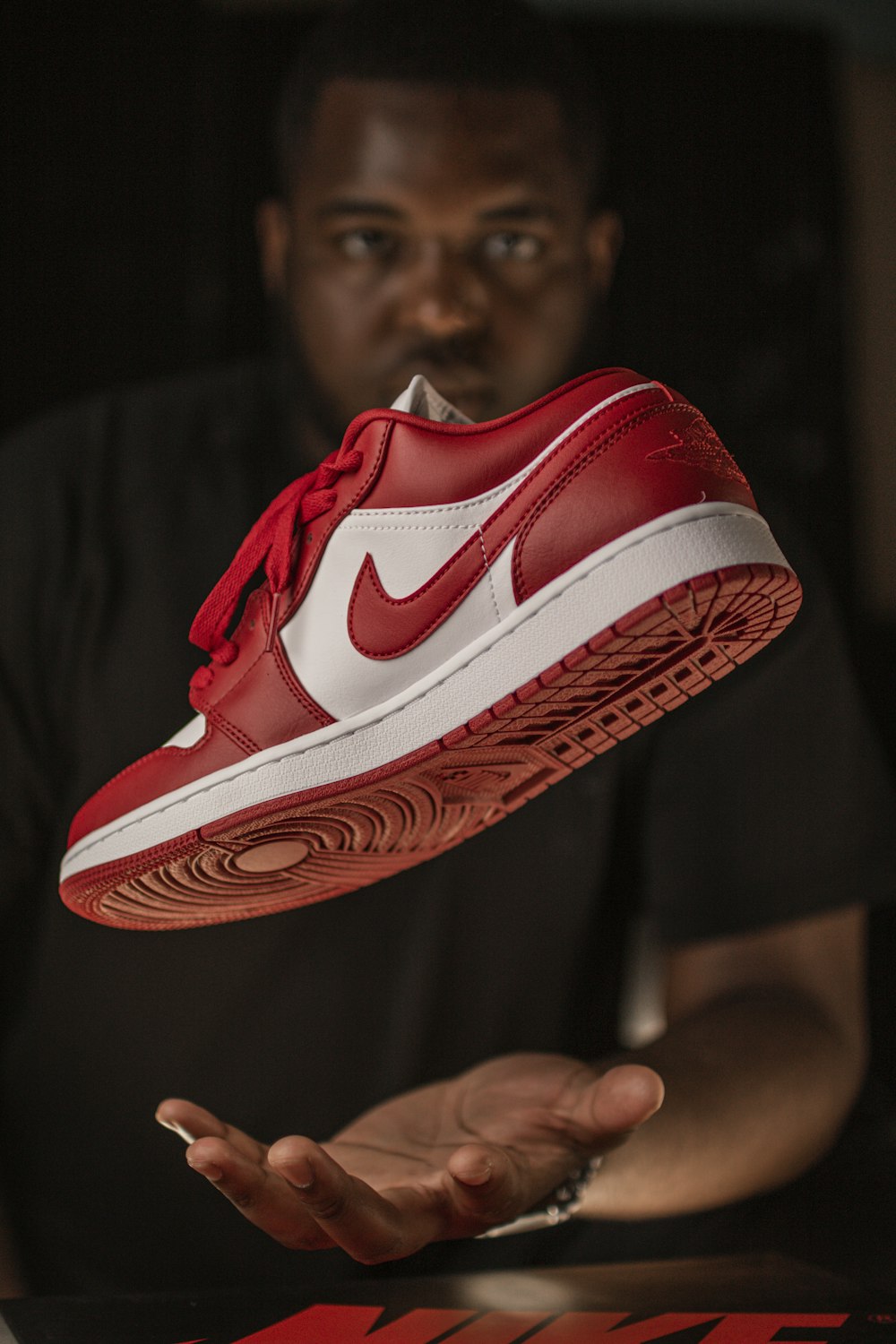 red and white nike athletic shoe photo – Free Black Image on Unsplash