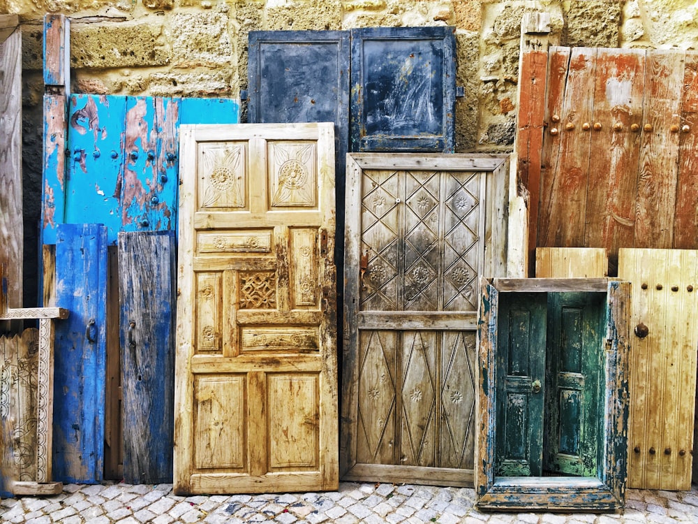 brown wooden door on brown brick wall