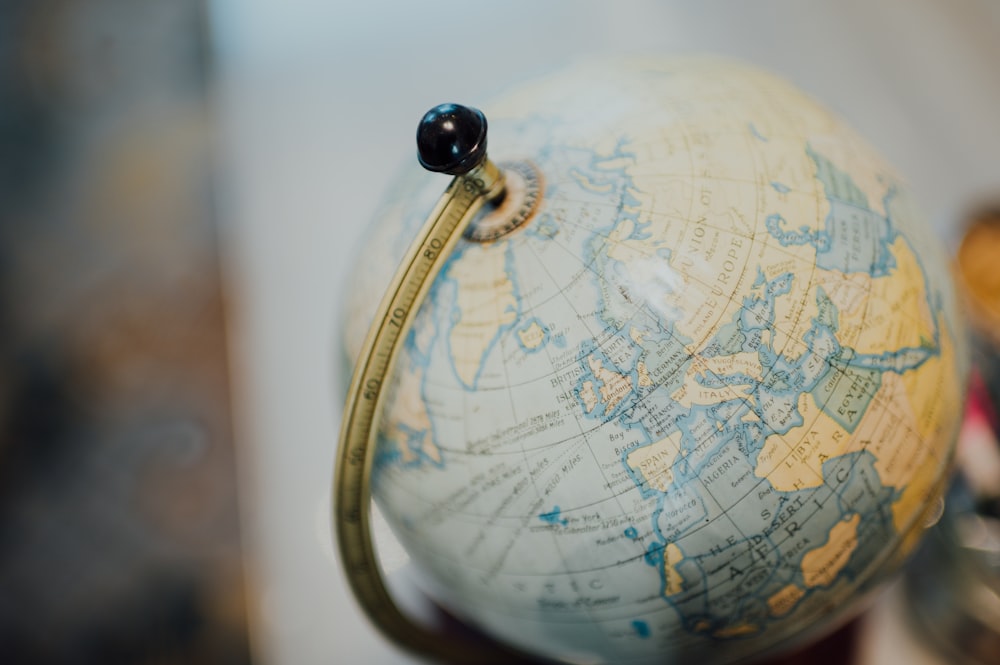 gold and silver desk globe