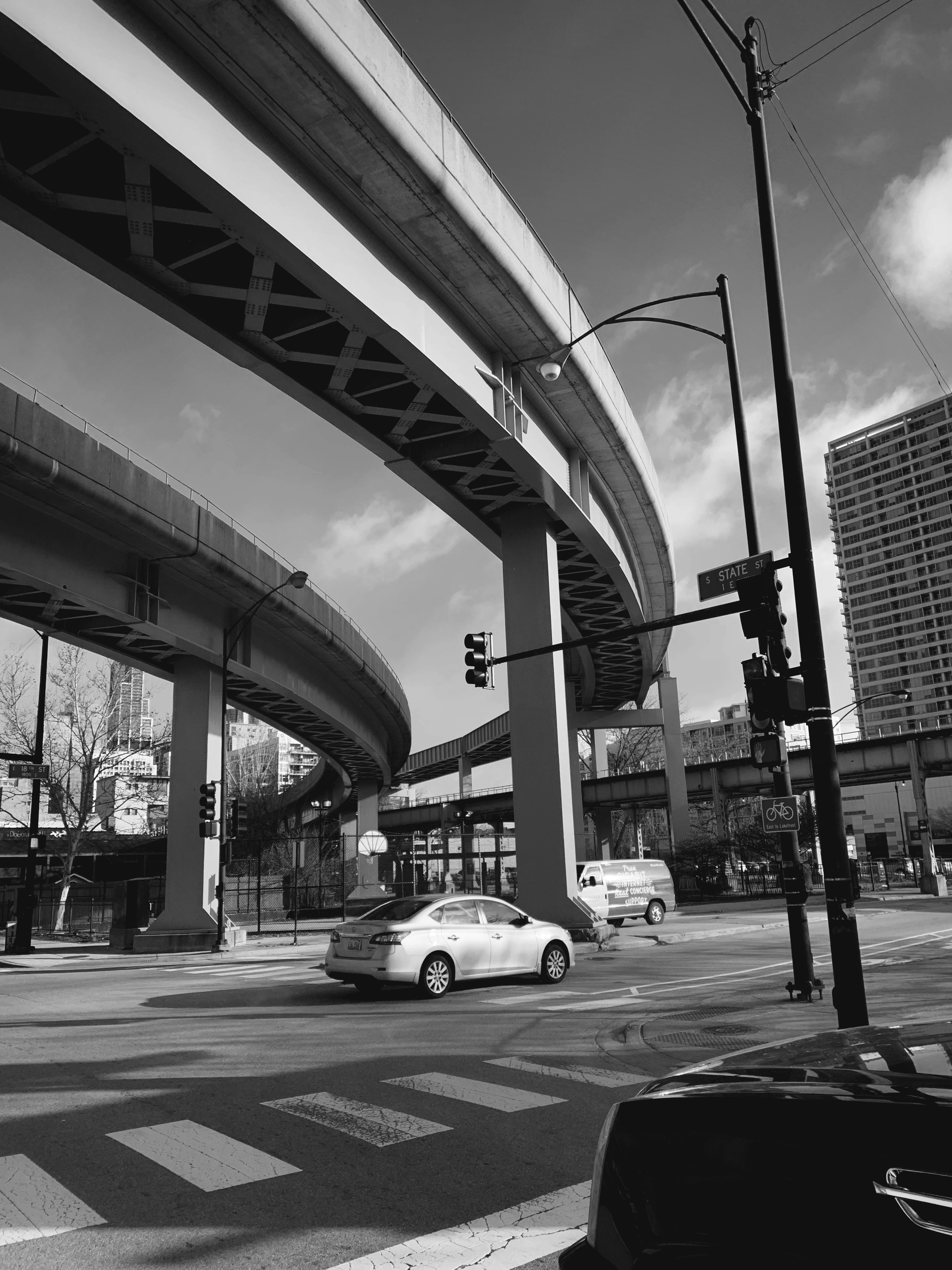 grayscale photo of cars on road