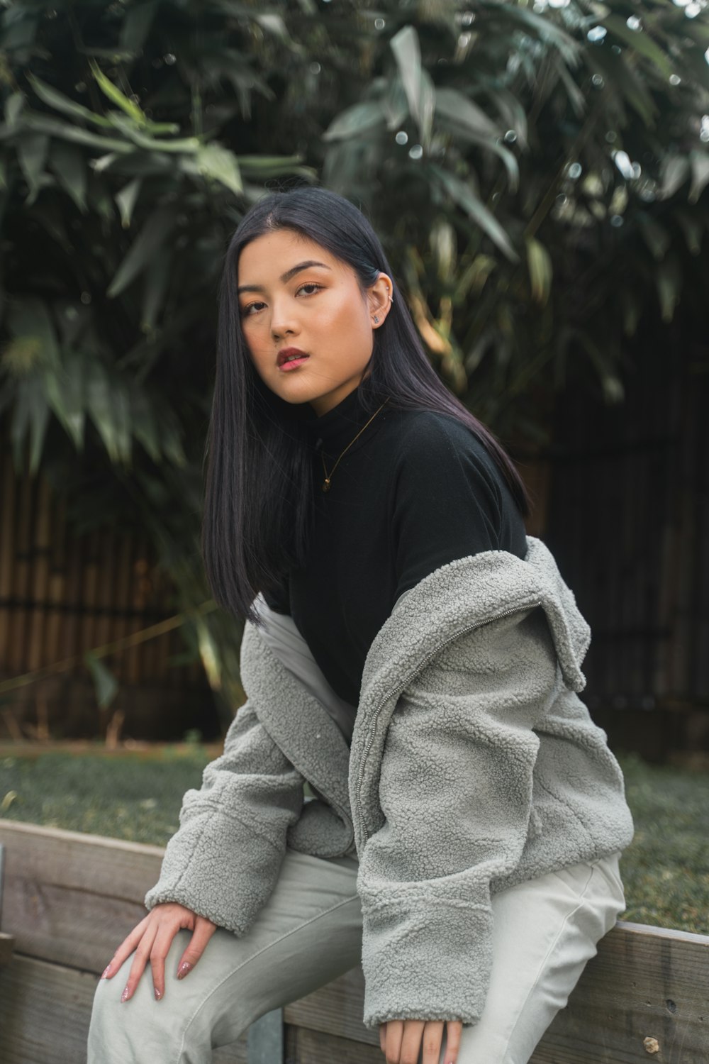 woman in black long sleeve shirt and gray scarf