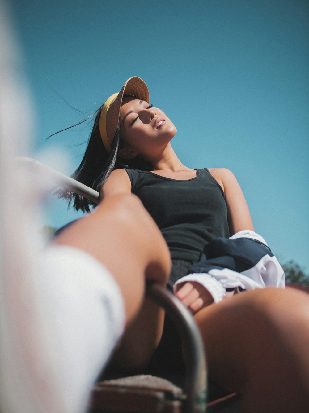 woman in black tank top wearing brown sunglasses