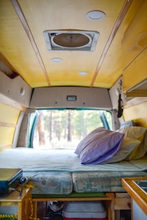 person in yellow jacket sitting on car seat